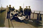 Jetty, using the trolly [c1920]